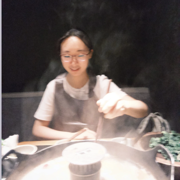 Amy enjoying hotpot at a restaurant